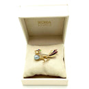 Spilla a forma di Pavone con Perla naturale grigia, Rubini e Smalto. Gioiello Secondo tempo